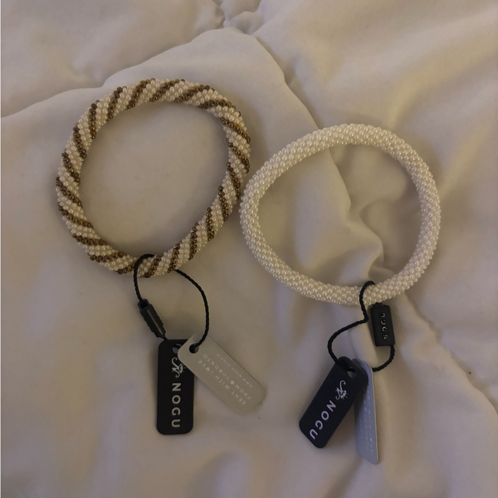 2 brand new NOGU Himalayan glass bead roll on bracelets Butter Pecan and white